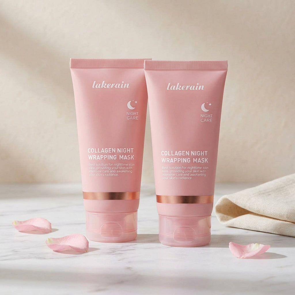 Collagen duo: two pink night mask tubes on marble with scattered rose petals and folded linen